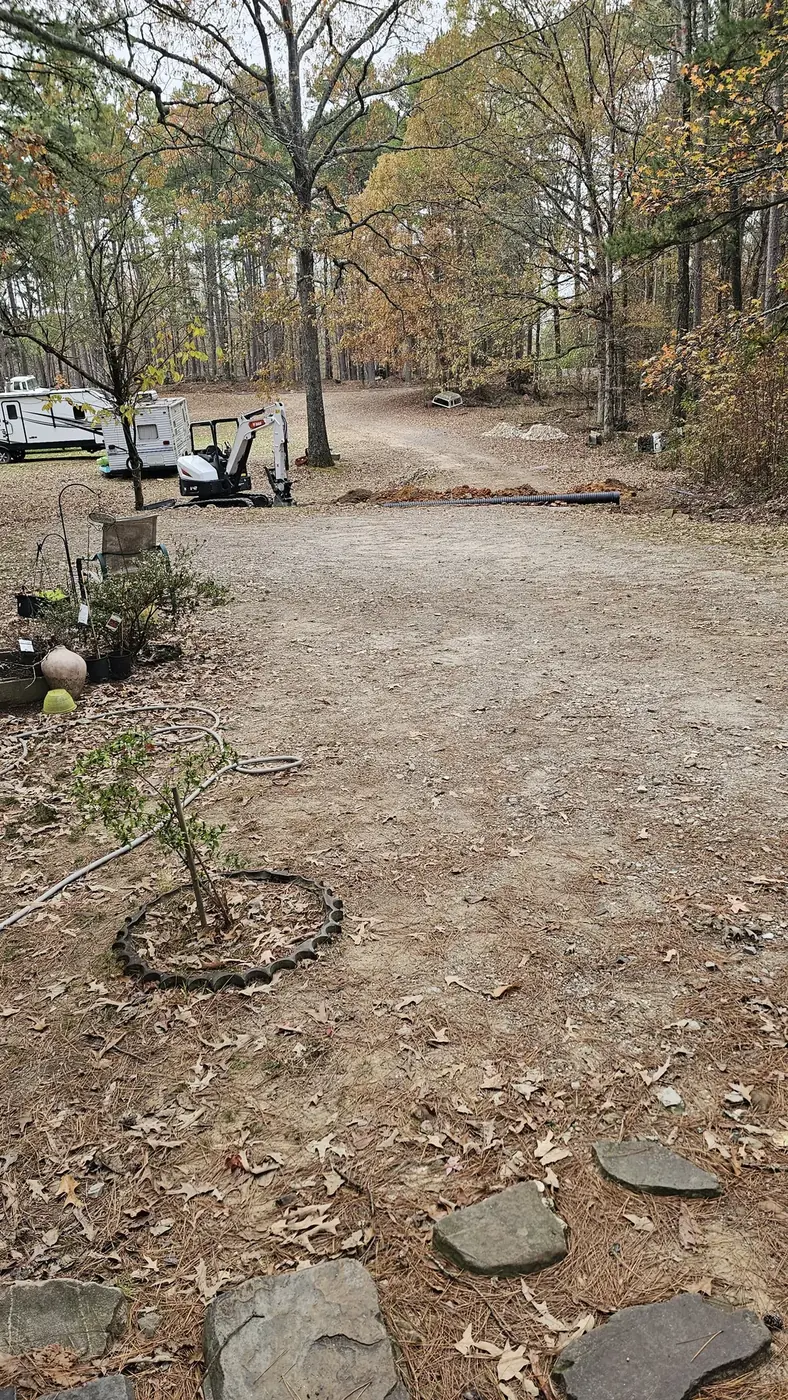 Rough gravel access at a wooded lot
